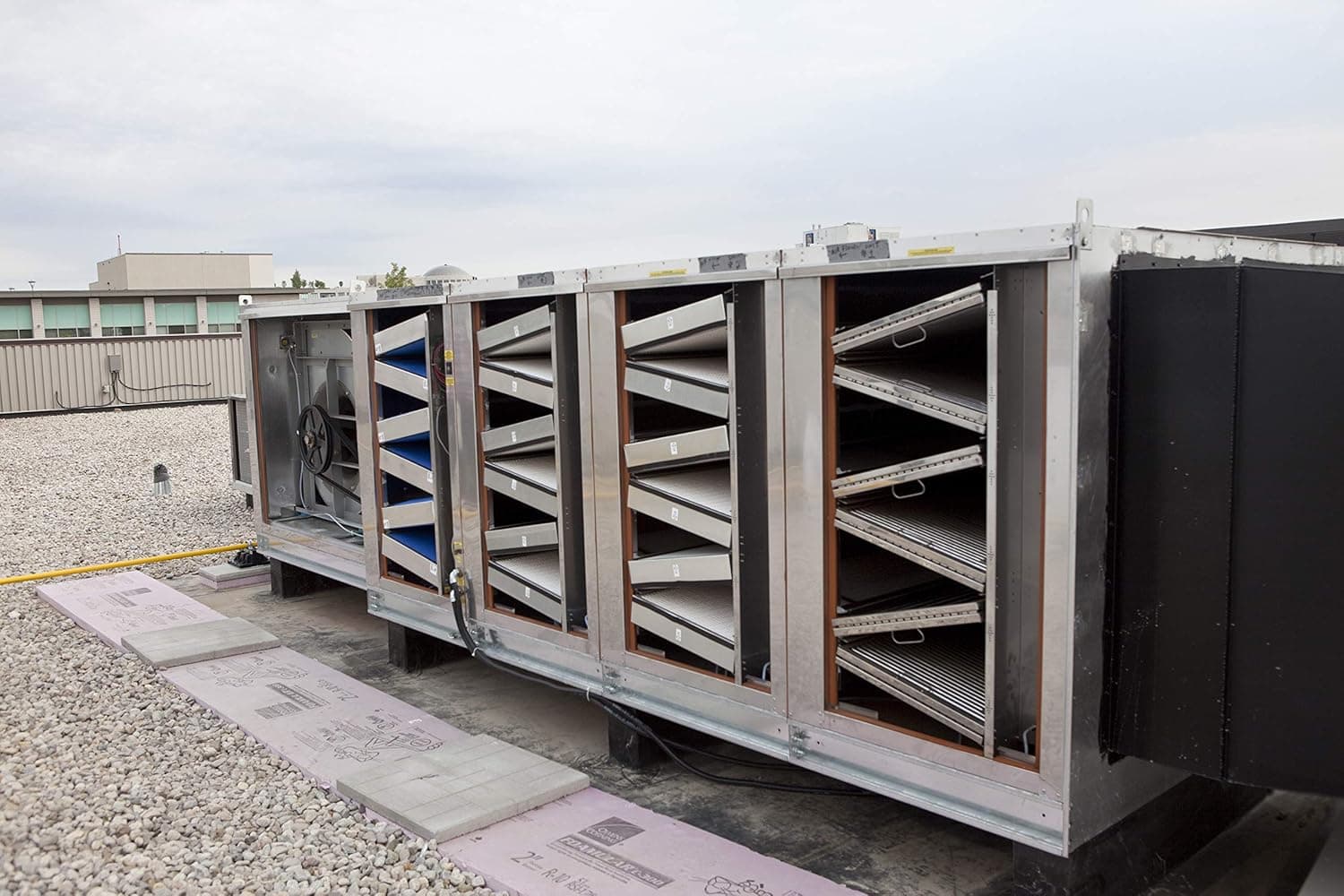 Technician inspecting commercial kitchen exhaust hood